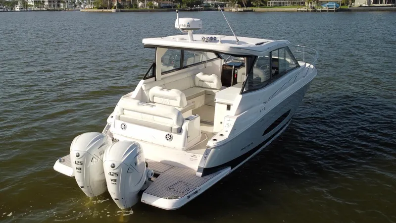 C Life Yacht Photos Pics 2021 Regal 36 XO boat with dual outboard engines on a calm lake.