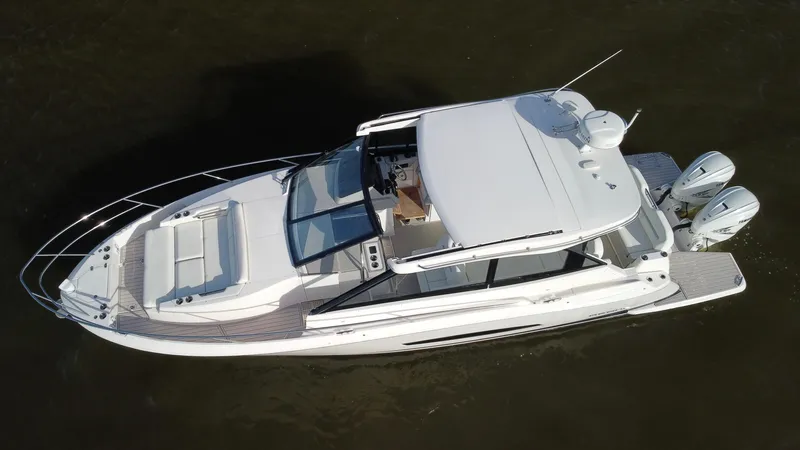 C Life Yacht Photos Pics 2021 Regal 36 XO boat, aerial view, sleek design, dual outboard motors, white exterior.