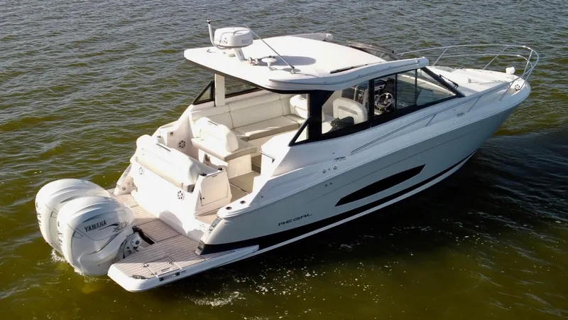 C Life Yacht Photos Pics 2021 Regal 36 XO boat on water, featuring sleek design and dual Yamaha engines.
