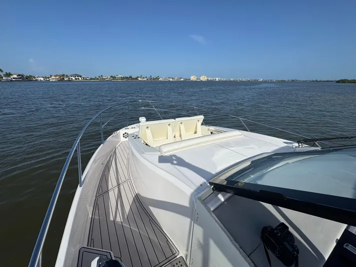 C Life Yacht Photos Pics 2021 Regal 36 XO yacht on calm water, showcasing sleek deck design.