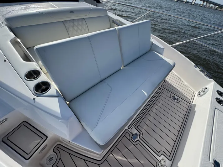 C Life Yacht Photos Pics Luxury seating on 2021 Regal 36 XO boat, featuring cup holders and elegant design.
