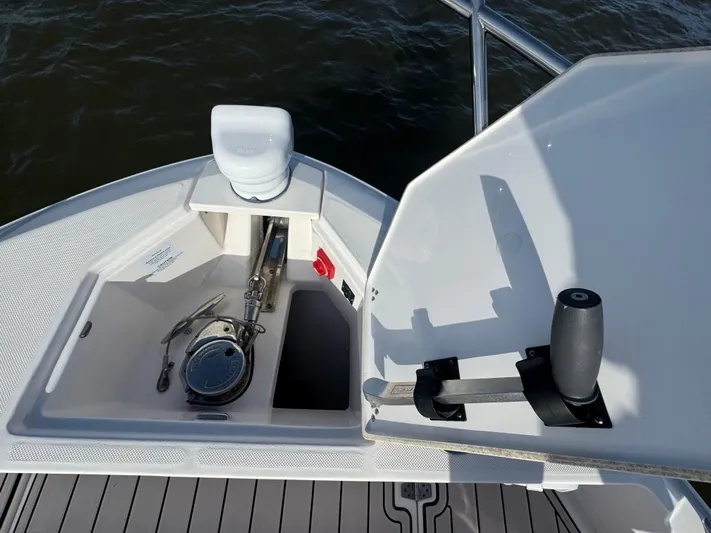 C Life Yacht Photos Pics Bow anchor compartment of 2021 Regal 36 XO boat, featuring anchor winch and controls.