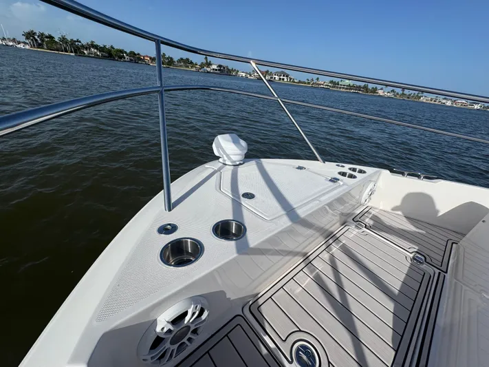 C Life Yacht Photos Pics Bow of 2021 Regal 36 XO yacht with cup holders and scenic water view.