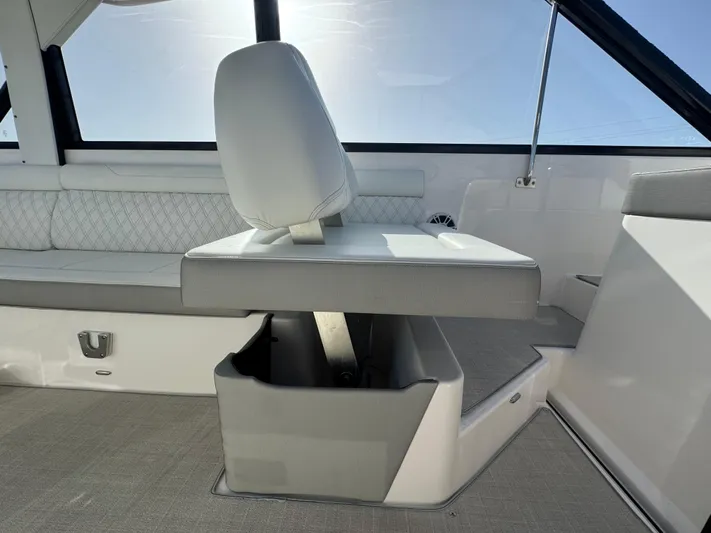 C Life Yacht Photos Pics 2021 Regal 36 XO boat interior with white seating and storage compartment.