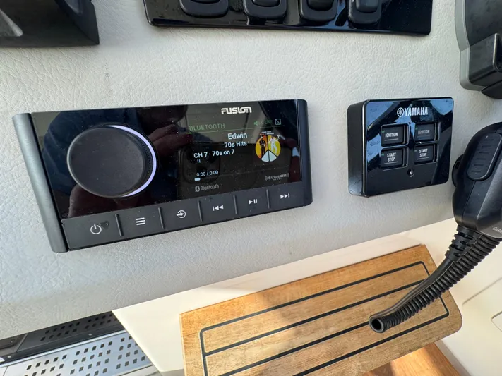 C Life Yacht Photos Pics Fusion Bluetooth stereo and Yamaha controls on 2021 Regal 36 XO boat dashboard.