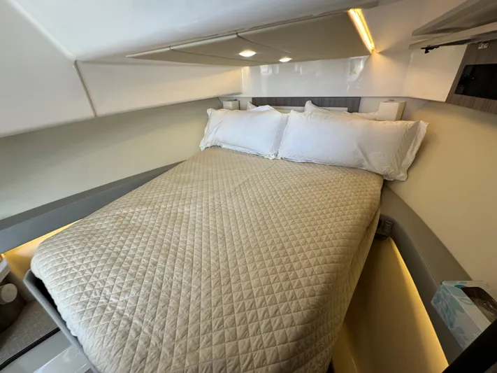 C Life Yacht Photos Pics 2021 Regal 36 XO cabin with cozy bed and modern lighting.