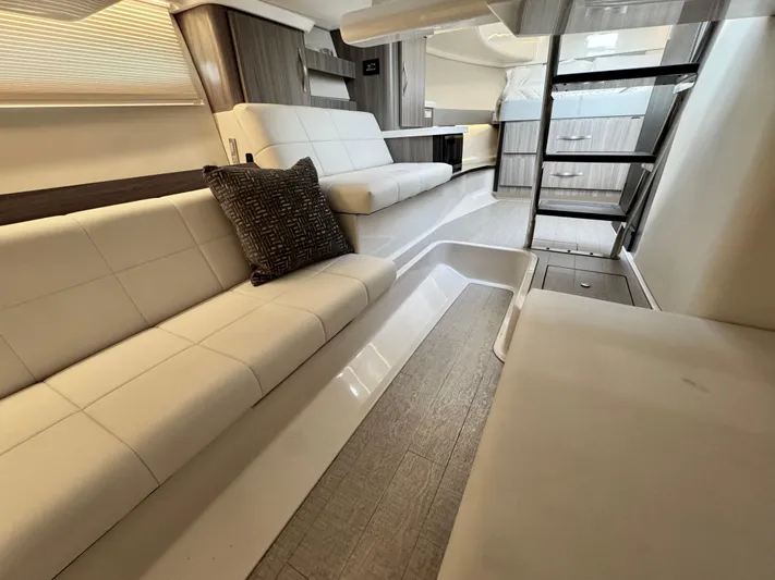 C Life Yacht Photos Pics 2021 Regal 36 XO yacht interior with modern seating and elegant design.