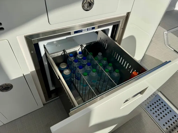 C Life Yacht Photos Pics Built-in cooler with drinks on a 2021 Regal 36 XO boat.