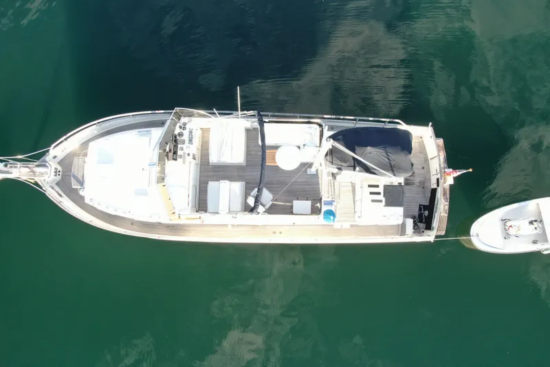 Maximon Yacht Photos Pics Aerial view of 1989 Grand Banks 46 Classic yacht on calm water.
