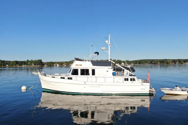 Maximon Yacht Photos Pics 1989 Grand Banks 46 Classic yacht on calm water, clear sky background.