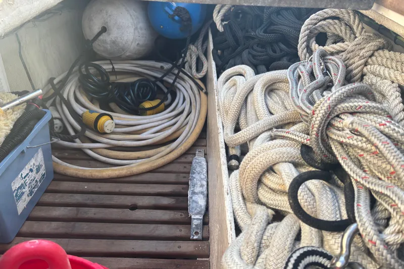 Maximon Yacht Photos Pics Storage area on a 1989 Grand Banks 46 Classic with ropes and cables neatly organized.
