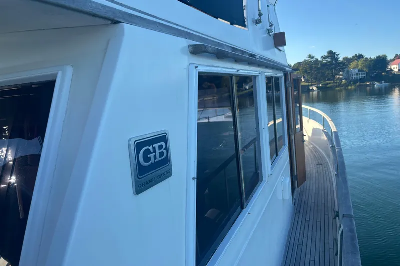 Maximon Yacht Photos Pics 1989 Grand Banks 46 Classic yacht on serene water, showcasing elegant design and craftsmanship.