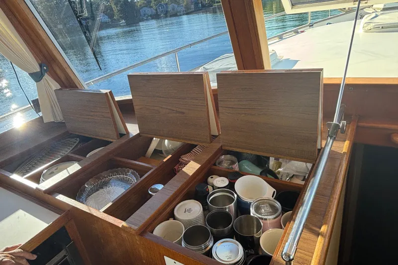 Maximon Yacht Photos Pics Interior view of 1989 Grand Banks 46 Classic yacht with open storage compartments.