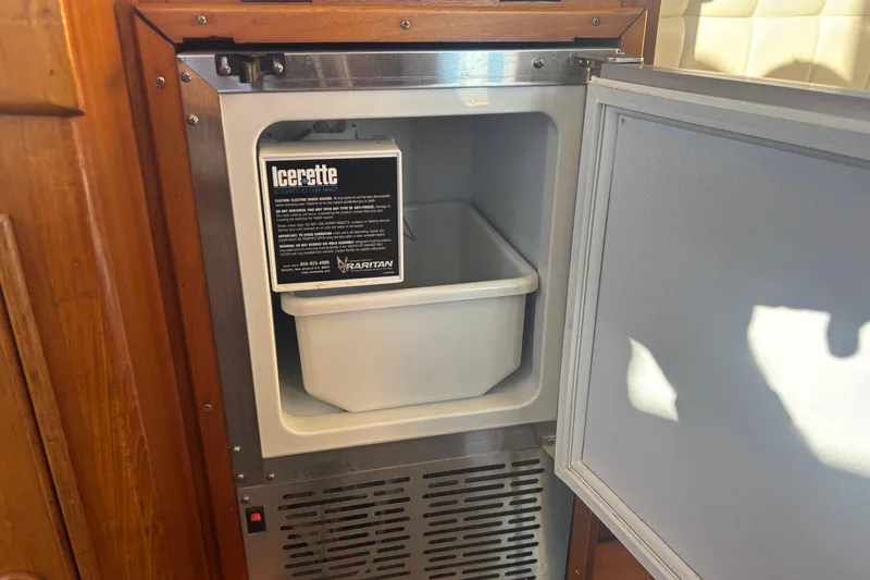 Maximon Yacht Photos Pics Ice maker inside 1989 Grand Banks 46 Classic yacht, featuring Raritan Icerette model.
