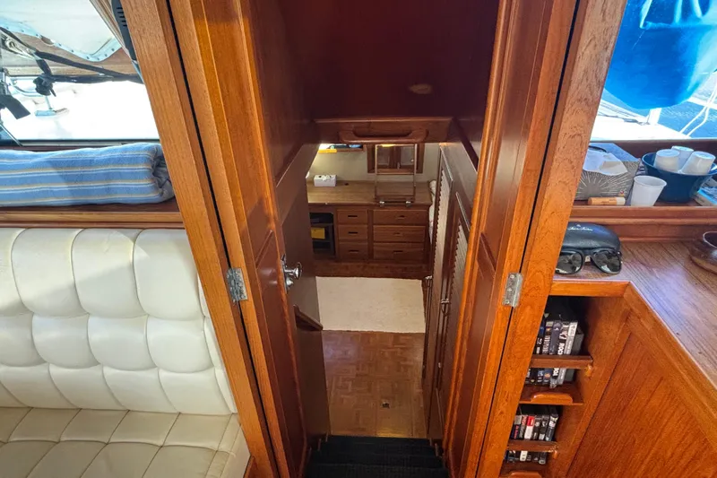 Maximon Yacht Photos Pics Interior view of 1989 Grand Banks 46 Classic yacht, featuring wooden cabinetry and seating.
