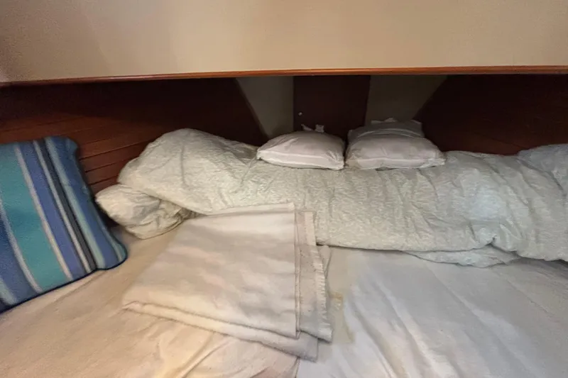Maximon Yacht Photos Pics Cozy cabin bed with pillows and blanket on 1989 Grand Banks 46 Classic yacht.