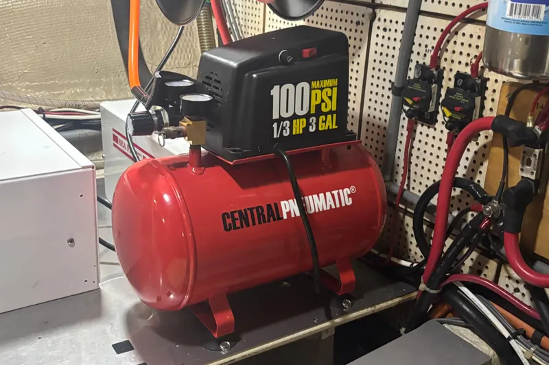 Maximon Yacht Photos Pics Red Central Pneumatic air compressor in a 1989 Grand Banks 46 Classic engine room.