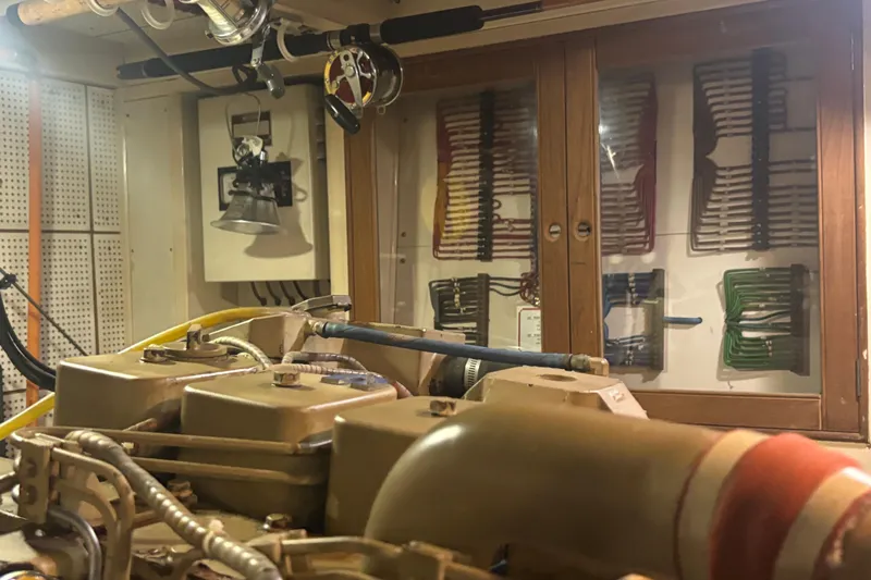 Maximon Yacht Photos Pics Engine room of 1989 Grand Banks 46 Classic yacht, showcasing mechanical components and wiring.