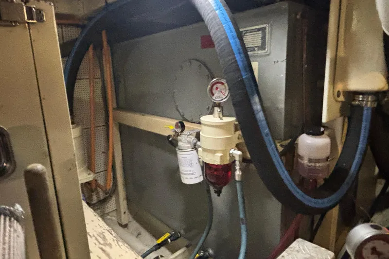 Maximon Yacht Photos Pics Engine room of 1989 Grand Banks 46 Classic with fuel filtration system and hoses.