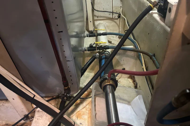 Maximon Yacht Photos Pics Engine room of 1989 Grand Banks 46 Classic with visible pipes and valves.