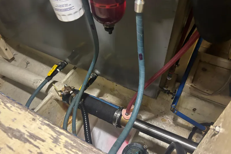 Maximon Yacht Photos Pics Engine room of 1989 Grand Banks 46 Classic with visible hoses and fittings.