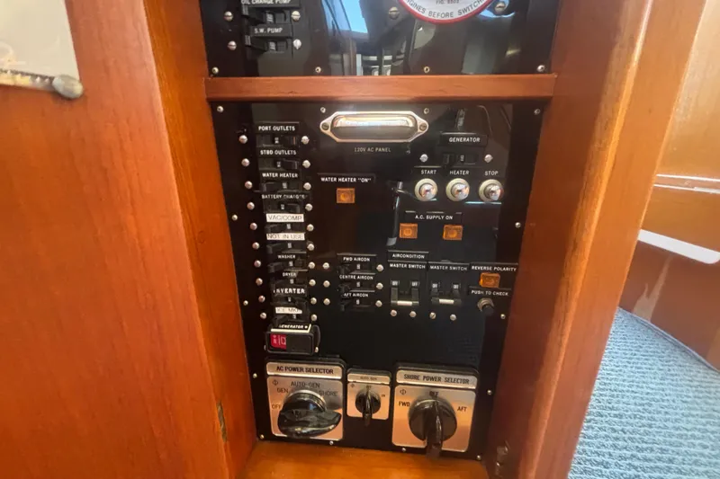 Maximon Yacht Photos Pics Control panel of a 1989 Grand Banks 46 Classic yacht, featuring various switches and dials.