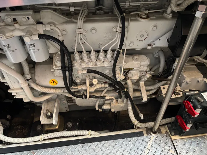  Yacht Photos Pics Engine compartment of a 2003 Carver 444 Cockpit Motor Yacht, showcasing detailed mechanical components.