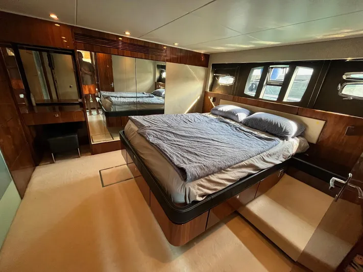  Yacht Photos Pics Luxurious bedroom in 2010 Fairline Squadron 65 yacht with elegant wood finishes.
