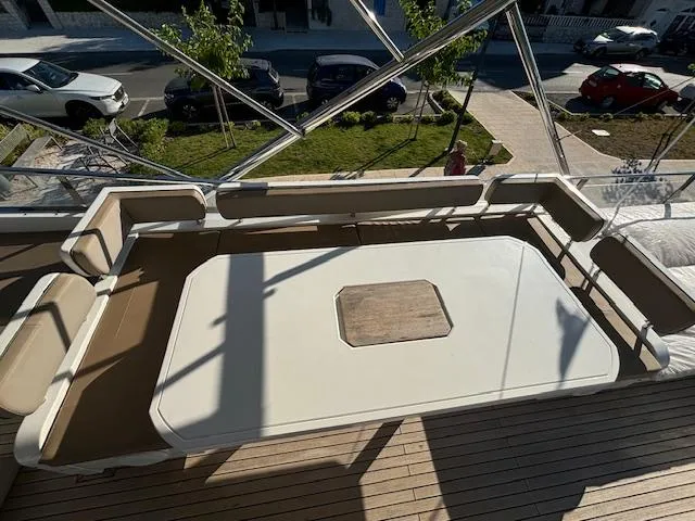  Yacht Photos Pics Spacious deck seating on 2010 Fairline Squadron 65 yacht, featuring elegant design and ample space.