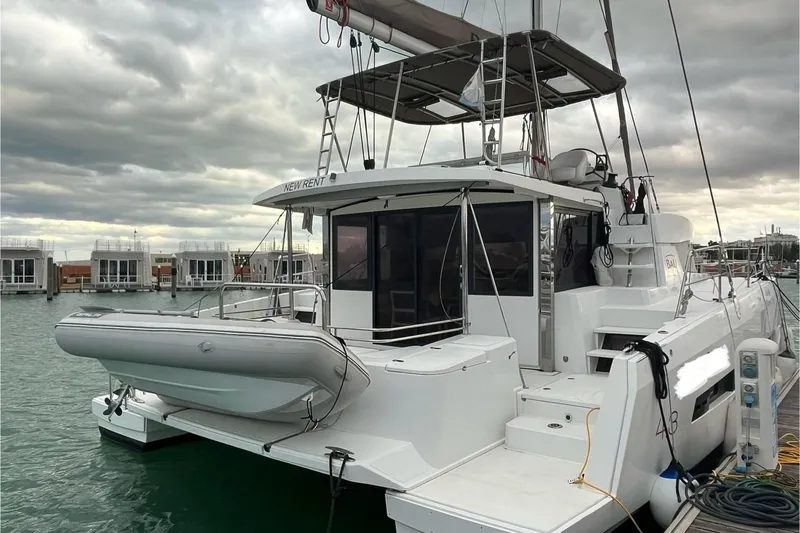 Yacht Photos Pics 2020 Bali 4.3 catamaran docked at marina under cloudy skies.