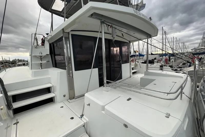 Yacht Photos Pics 2020 Bali 4.3 catamaran docked, showcasing spacious deck and modern design under cloudy skies.