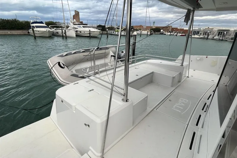  Yacht Photos Pics 2020 Bali 4.3 catamaran docked, featuring spacious deck and inflatable dinghy.