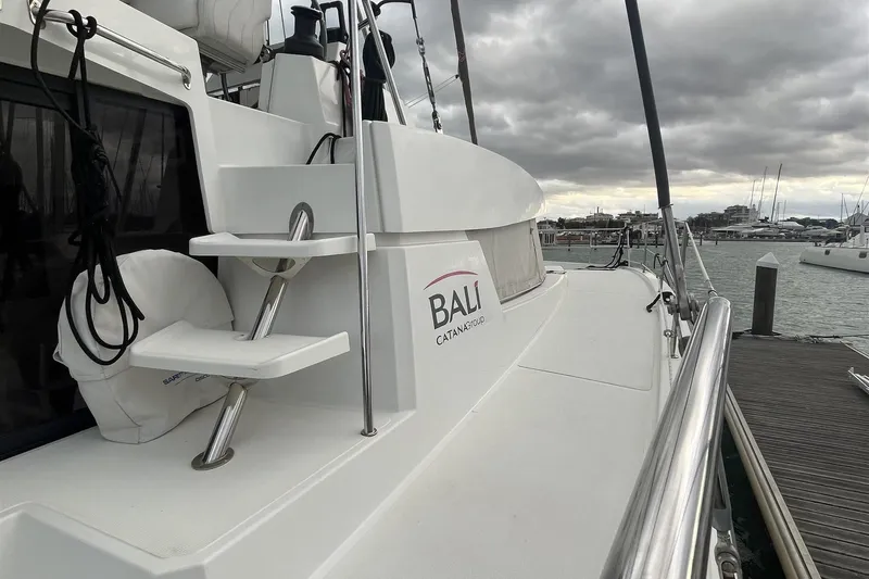  Yacht Photos Pics 2020 Bali 4.3 catamaran docked at marina under cloudy skies.