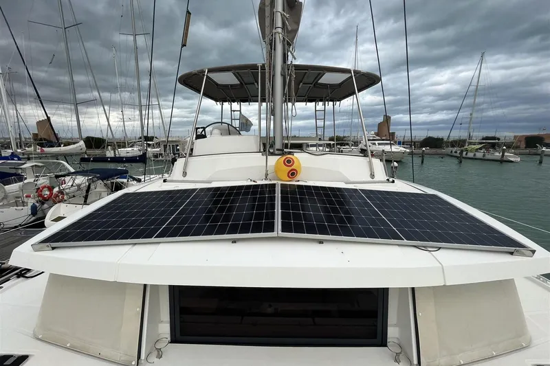  Yacht Photos Pics 2020 Bali 4.3 catamaran with solar panels docked under cloudy skies.