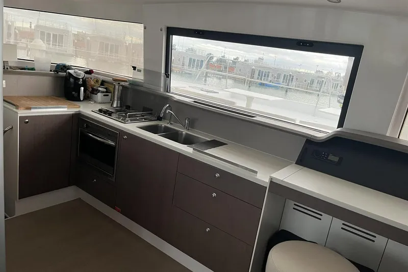  Yacht Photos Pics Modern kitchen interior on 2020 Bali 4.3 yacht with appliances and large window view.