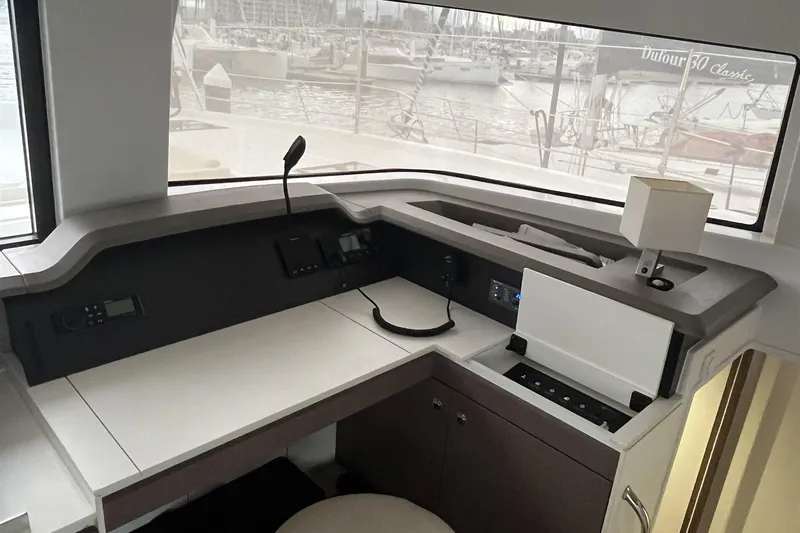  Yacht Photos Pics Interior of a 2020 Bali 4.3 yacht with navigation equipment and marina view.