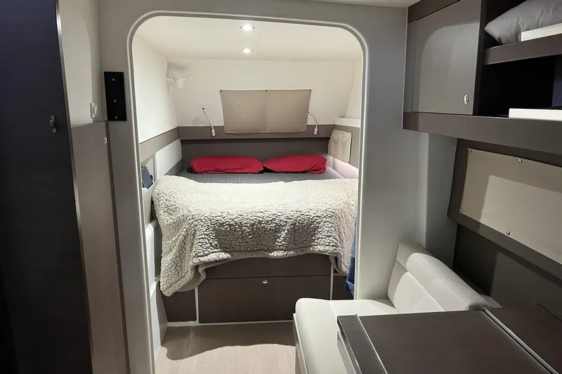  Yacht Photos Pics Cozy interior of a 2020 Bali 4.3 yacht cabin with bed and seating area.