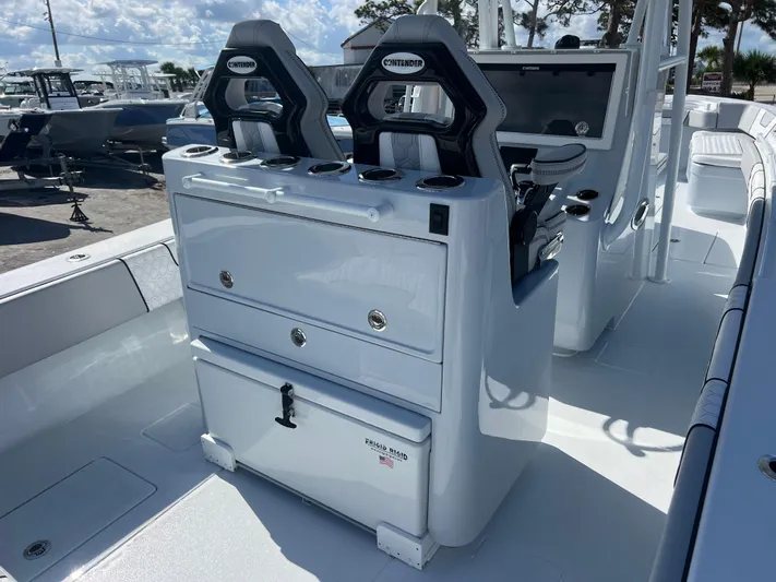  Yacht Photos Pics 2025 Contender 32 ST boat interior with dual seats and storage compartments.