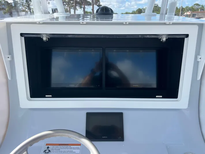  Yacht Photos Pics Dashboard of 2025 Contender 32 ST boat with dual screens and steering wheel.