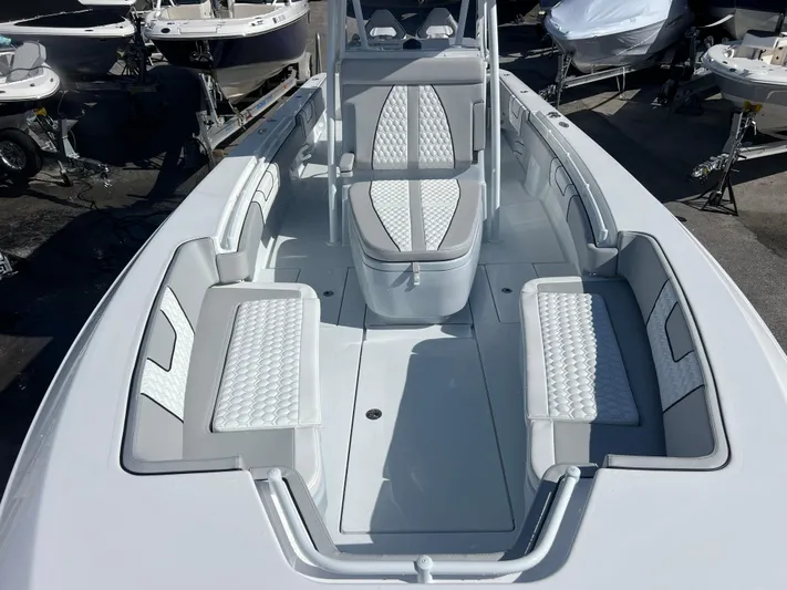  Yacht Photos Pics 2025 Contender 32 ST boat interior with cushioned seating and sleek design.