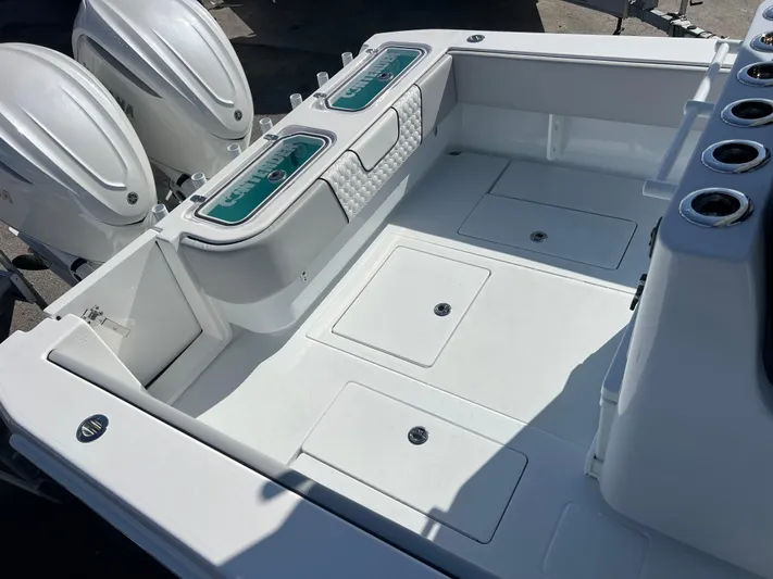  Yacht Photos Pics 2025 Contender 32 ST boat deck with dual engines and storage compartments.