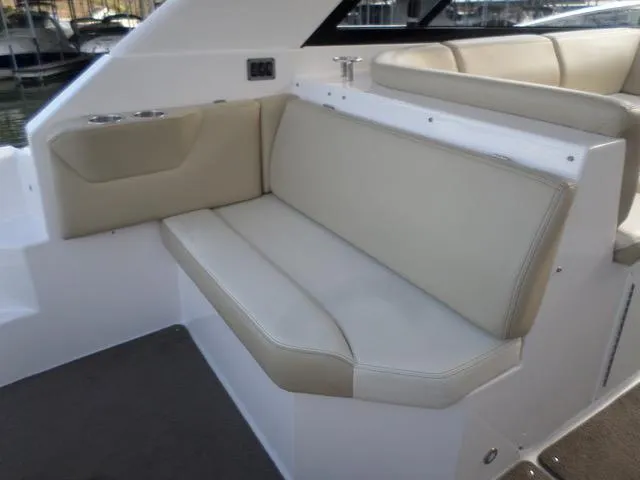 As Good As It Gets Yacht Photos Pics 2012 Regal 42 Sport Coupe beige leather seating area on deck.
