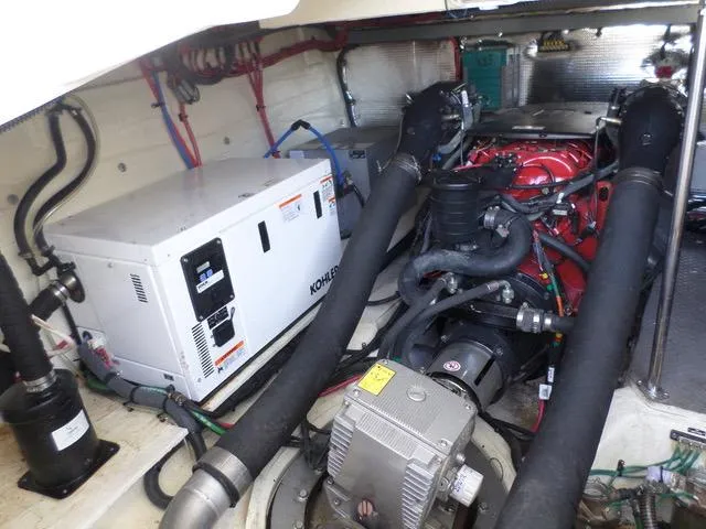 As Good As It Gets Yacht Photos Pics Engine room of a 2012 Regal 42 Sport Coupe with Kohler generator.