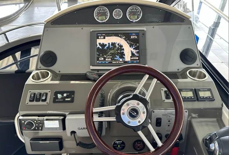 As Good As It Gets Yacht Photos Pics 2012 Regal 42 Sport Coupe helm with navigation system and controls.