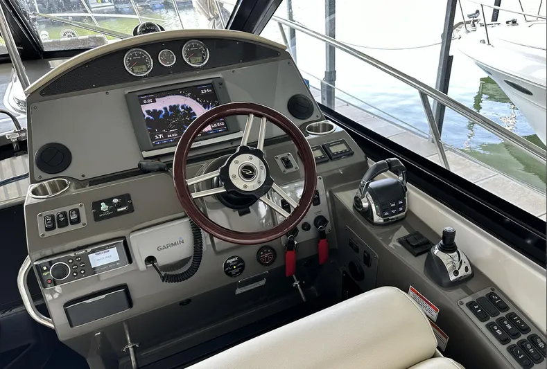 As Good As It Gets Yacht Photos Pics 2012 Regal 42 Sport Coupe helm with advanced navigation and control systems.