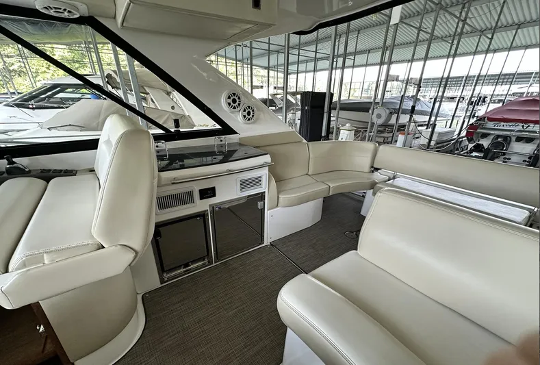 As Good As It Gets Yacht Photos Pics Interior of 2012 Regal 42 Sport Coupe yacht with white leather seating.