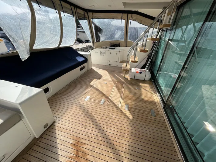  Yacht Photos Pics 2010 Fairline Squadron 65 yacht deck with seating and spiral staircase.