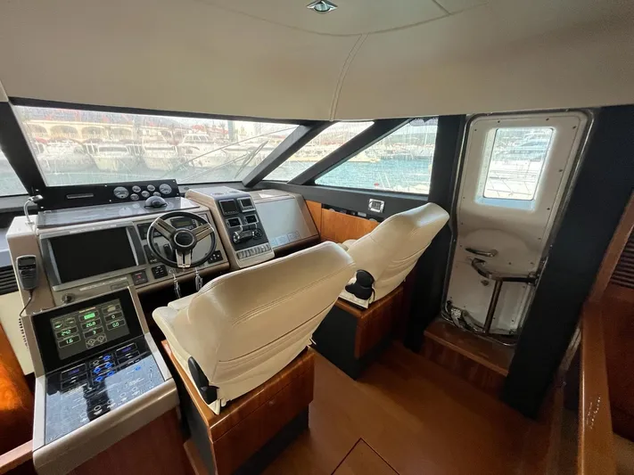  Yacht Photos Pics Pilothouse of 2010 Fairline Squadron 65 yacht with modern controls and panoramic windows.