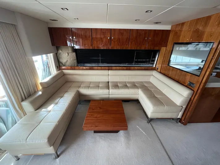  Yacht Photos Pics Luxurious interior of 2010 Fairline Squadron 65 yacht with cream leather seating and wooden accents.