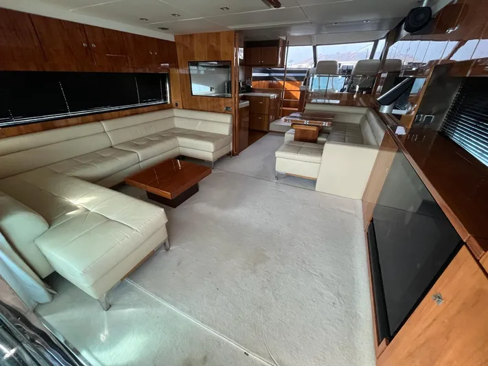  Yacht Photos Pics Luxurious interior of 2010 Fairline Squadron 65 yacht with elegant seating and wood finishes.